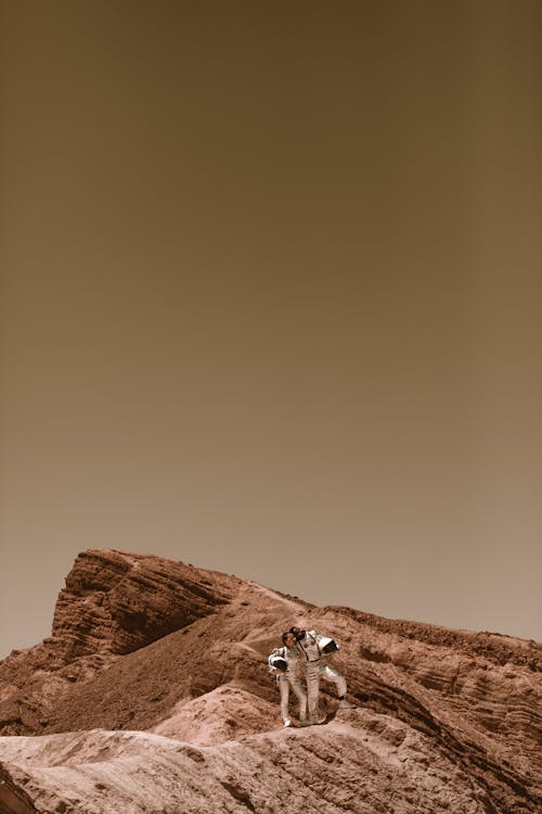 Astronauts Posing on the Rock Formation on Mars 