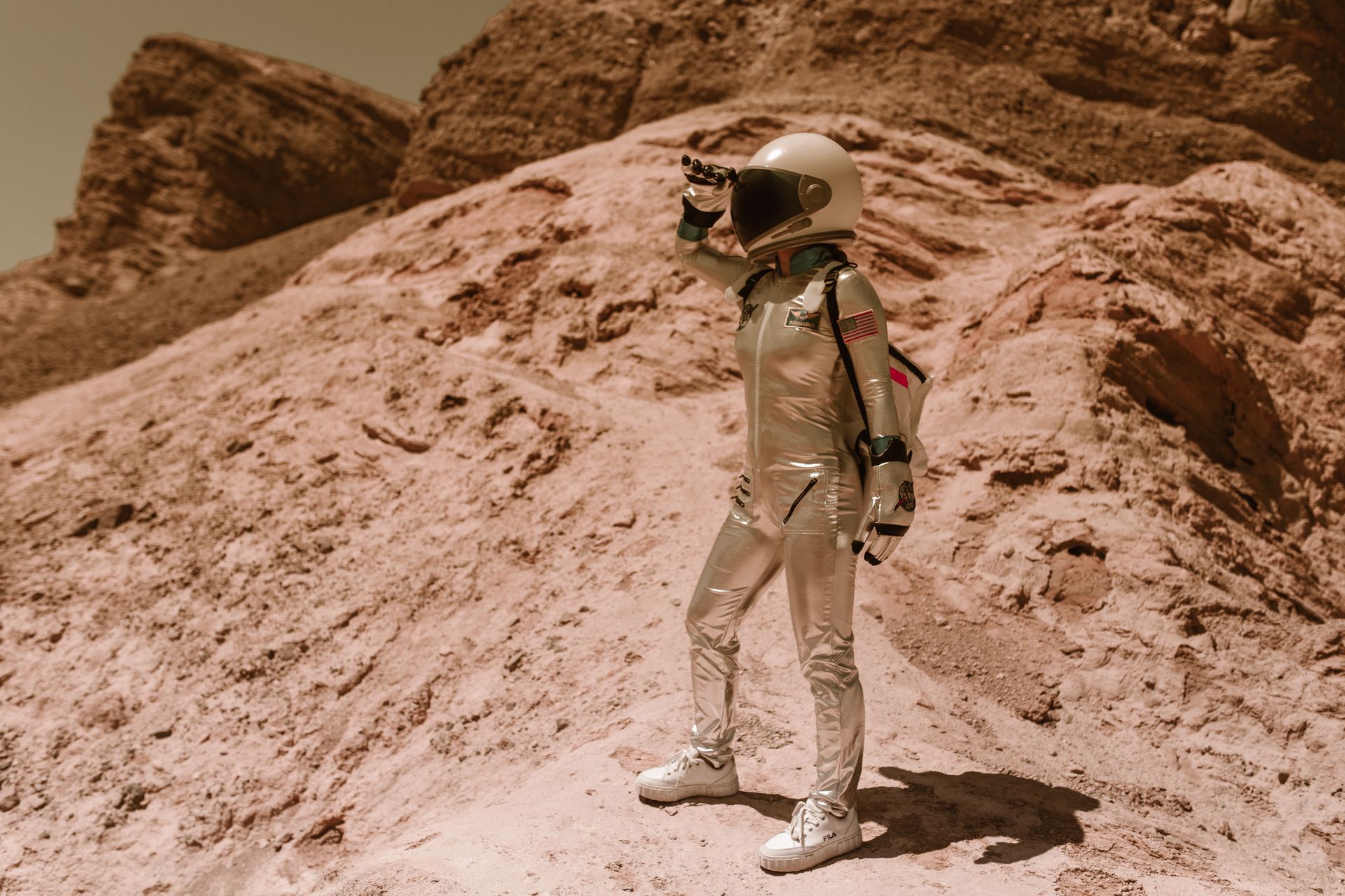 Astronaut Standing on a Rock on Mars and Looking