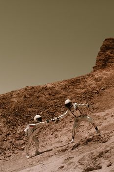 Two astronauts navigate steep rocky terrain in space suits, symbolizing exploration.