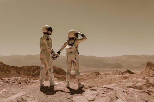 Astronauts Walking on the Sand