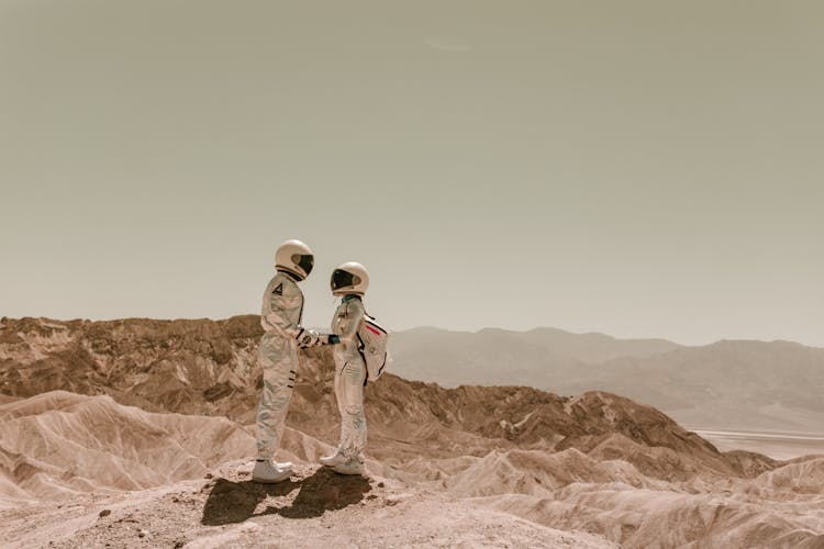 Astronauts Holding Hands On Mars