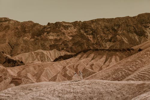 Drone Shot of Astronauts in a Desolate Area