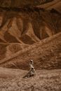 Grayscale Photo of Man Riding Motorcycle on Road