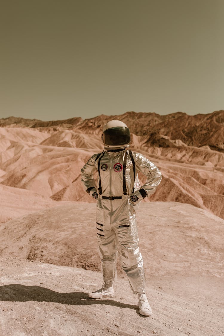 A Person In Space Suit Posing With Hands On Waist