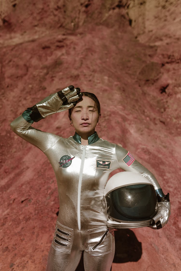 A Female Astronaut Doing A Salute