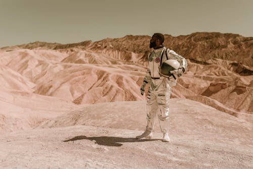 Free A Male Astronaut Standing in a Desolate Area Stock Photo