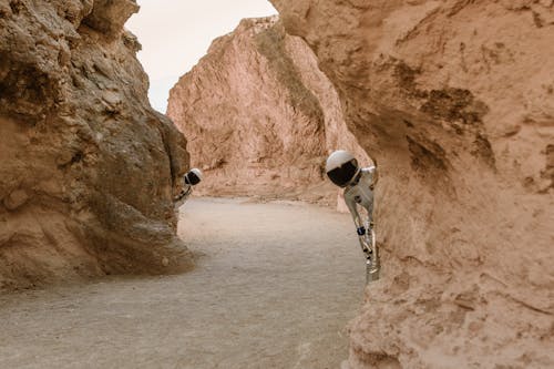 Astronauts Hiding Behind Rocks on Mars