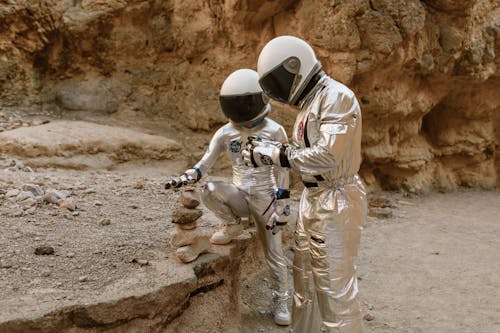 Astronauts Balancing Rocks