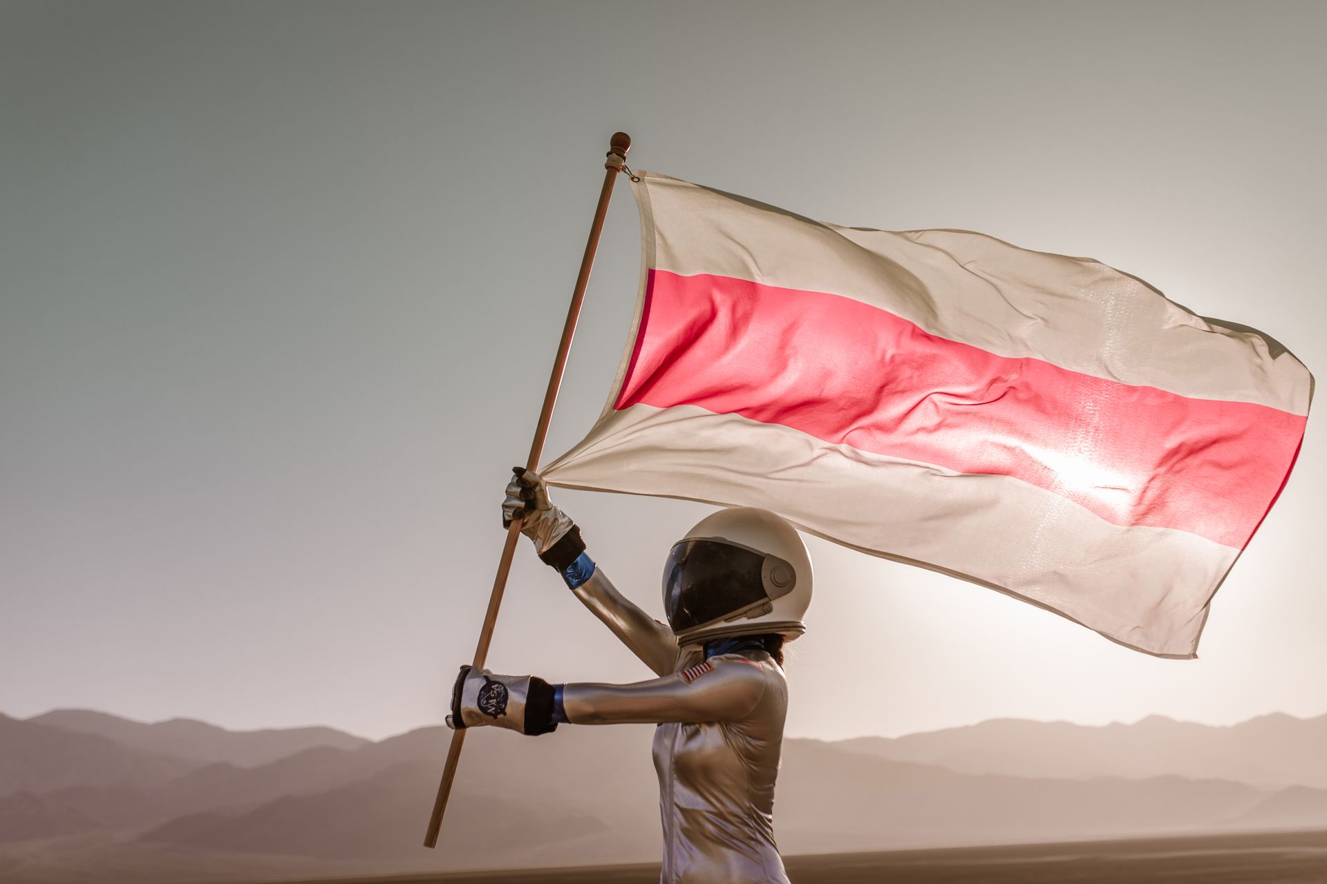 An Astronaut Holding the Flag of Belarus