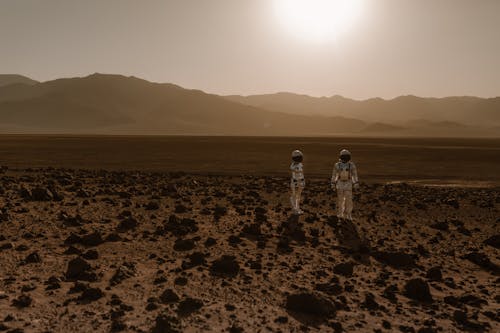 Free Astronauts Standing on Ground Stock Photo