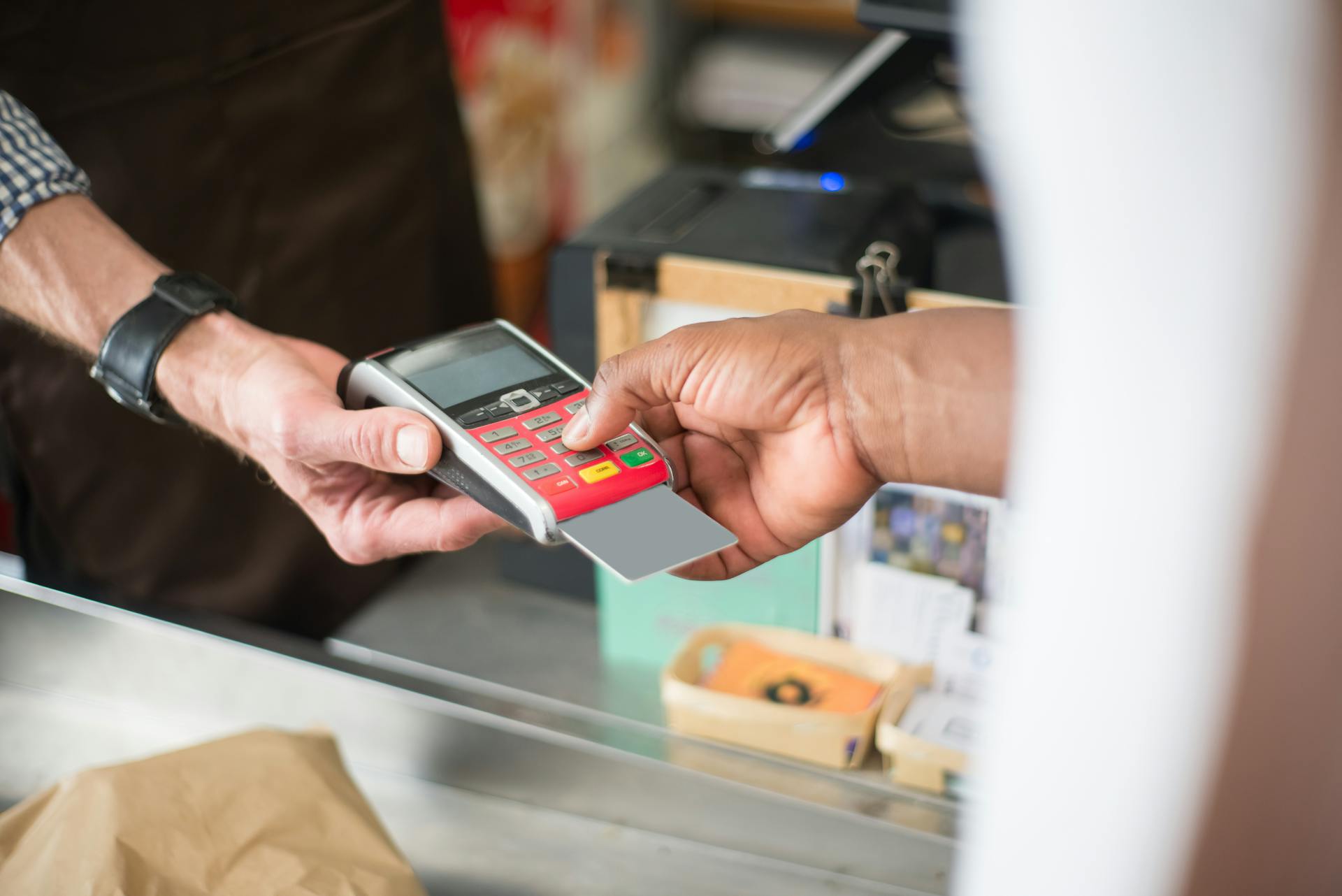 A Person Paying with a Bank Card