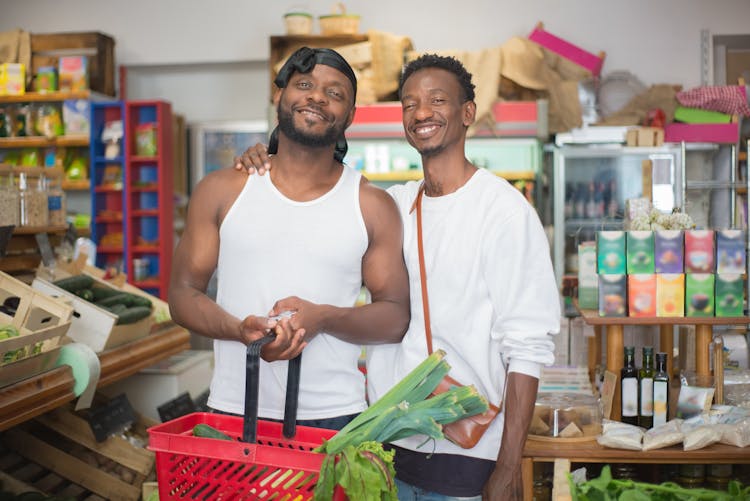 Men Shopping For Vegetables In A Grocery