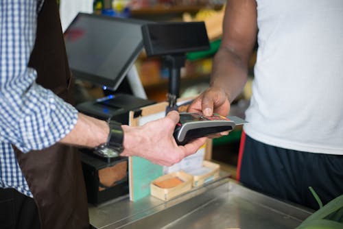 Free Paying in a Counter Using a Bank Card Stock Photo