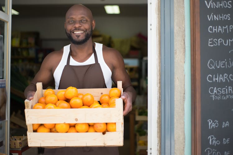 Man Selling Fruits In A Grocery 