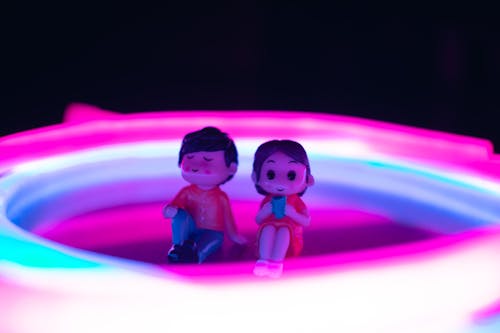 Close Up of Figurines in Colorful Light