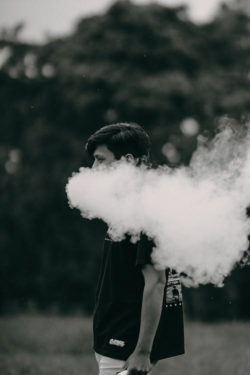 Free Grayscale Photo of a Man Smoking Stock Photo
