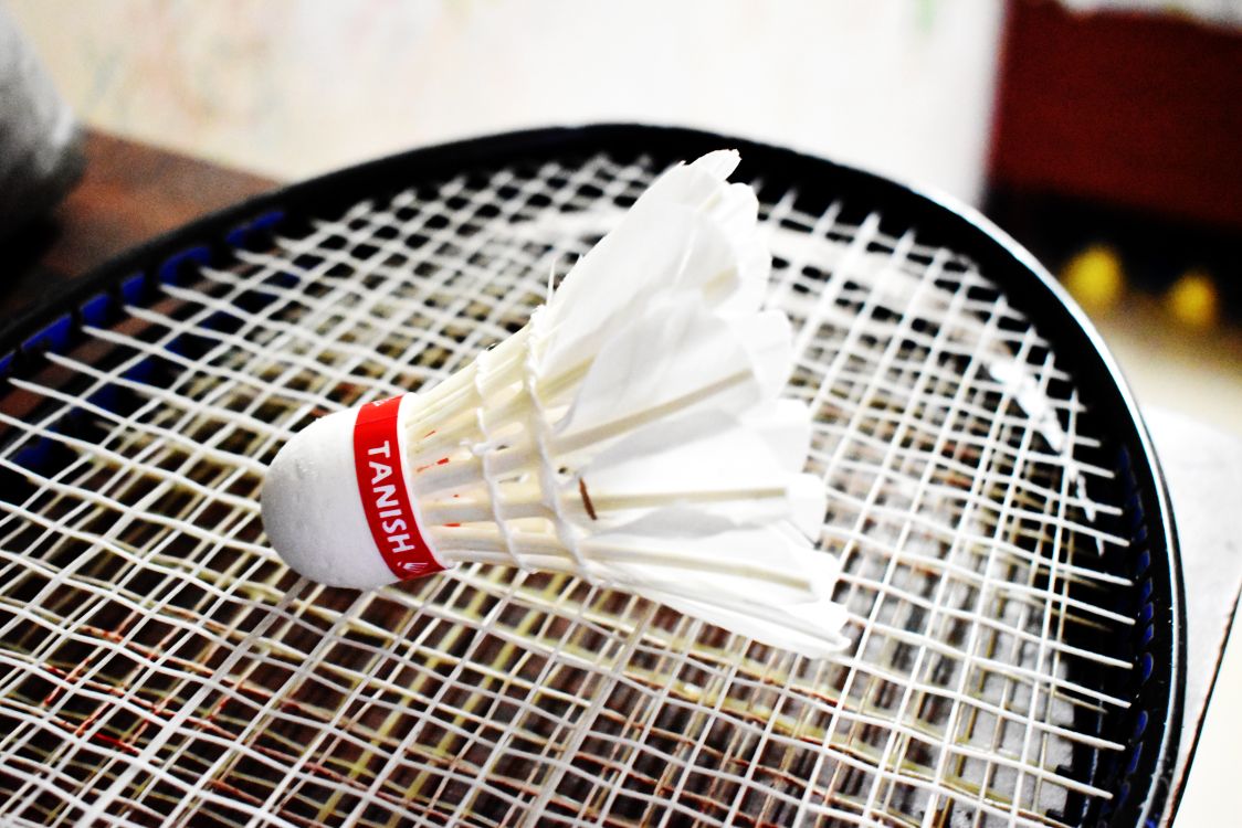 Shuttle Cock Racquet Close-Up Shot of a Shuttlecock on a Racket · Free Stock Photo