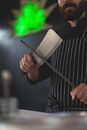 A Chef Sharpening a Knife Using a Honing Steel