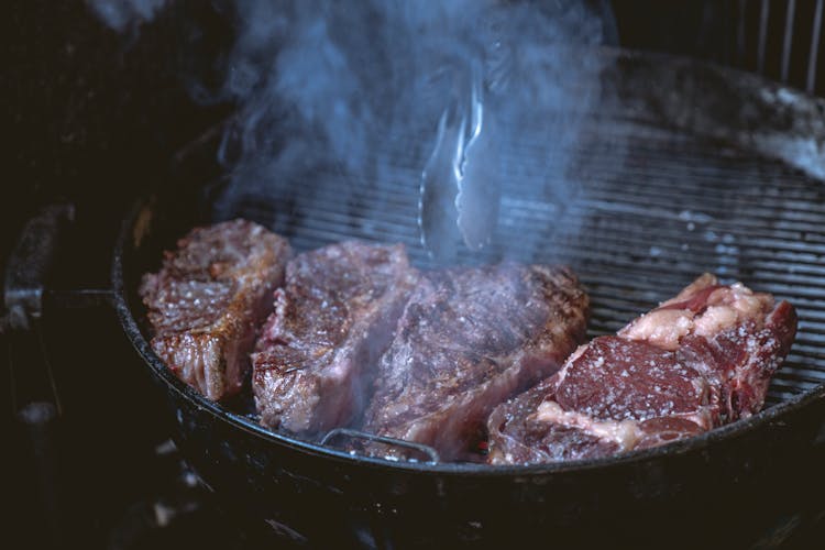 Close-Up Photo Of Steak On Barbeque Grill