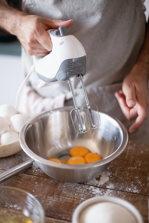 Free Person Holding a Hand Mixer Stock Photo
