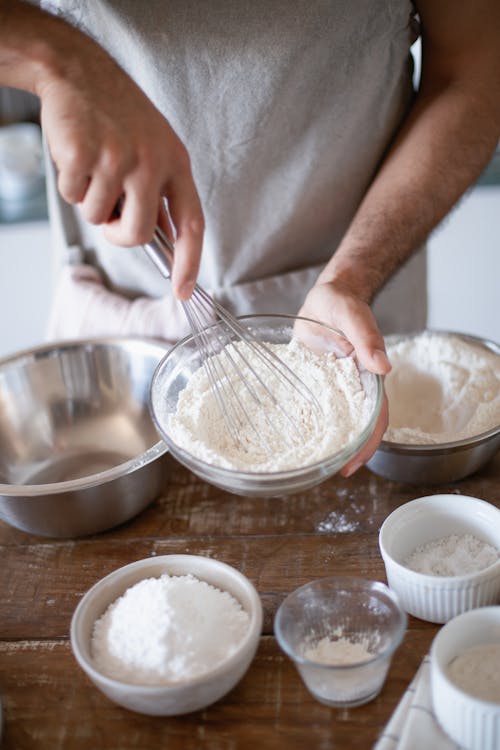 Free Person Holding a Bowl of Flour Stock Photo