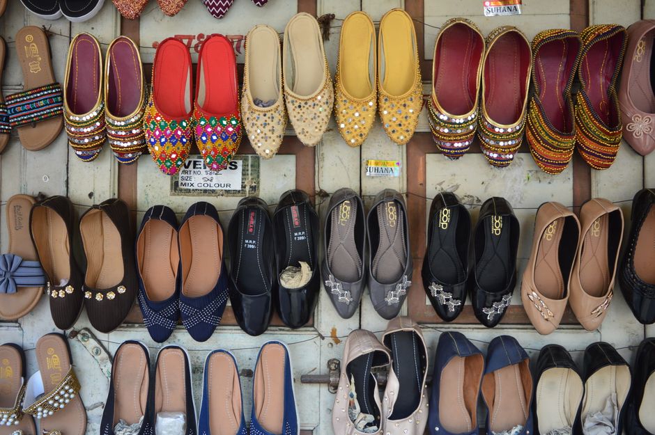 A vibrant collection of traditional footwear displayed in an organized arrangement.