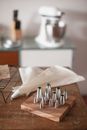 A Variety of Piping Bag Tips on a Kitchen Counter Top