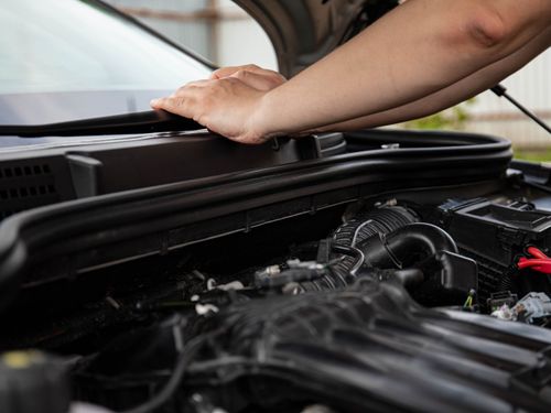 Close-up of an engine bay during inspection