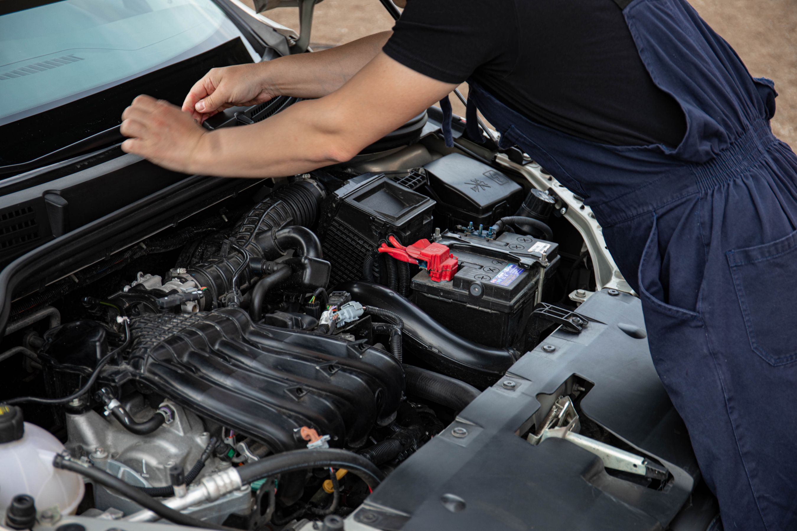 Mobile mechanic working on a car engine in Las Vegas