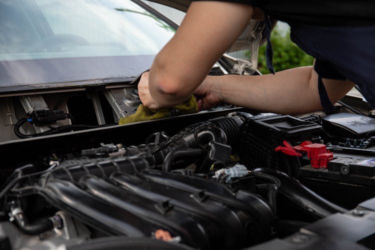 Close-up Of A Mechanic Fixing A Car