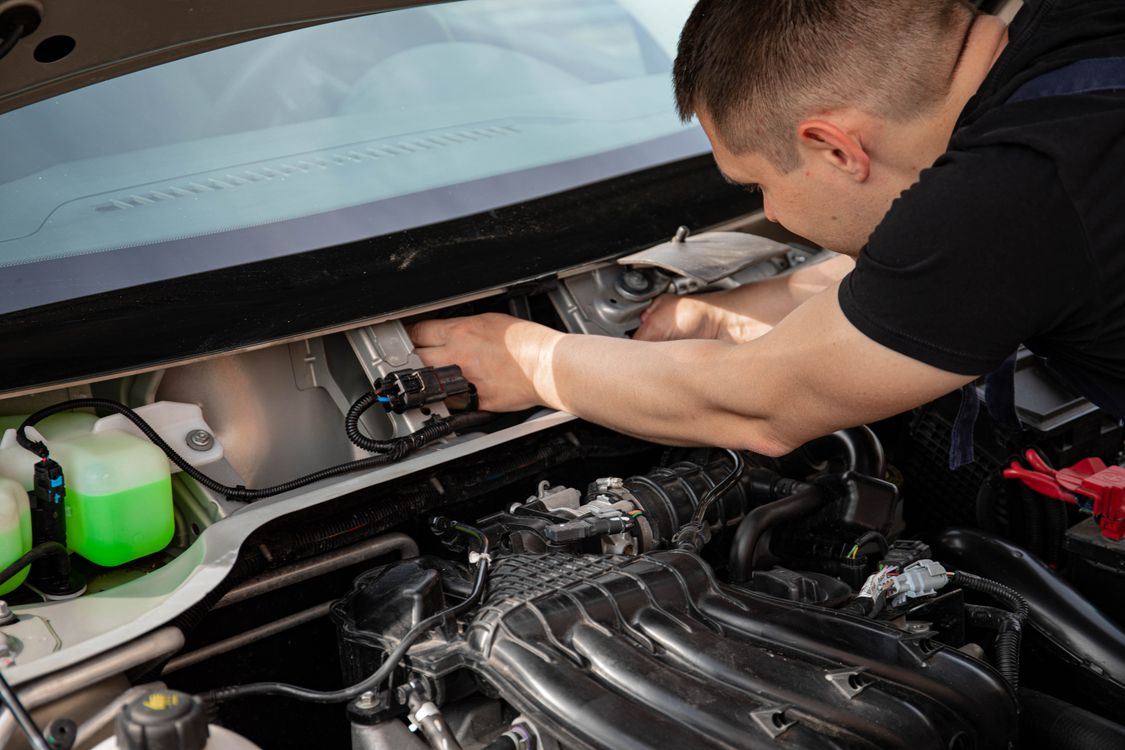 Man Fixing a Car · Free Stock Photo