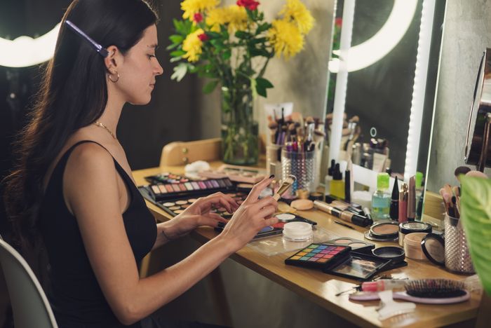 Bridal glam makeup application at the vanity mirror