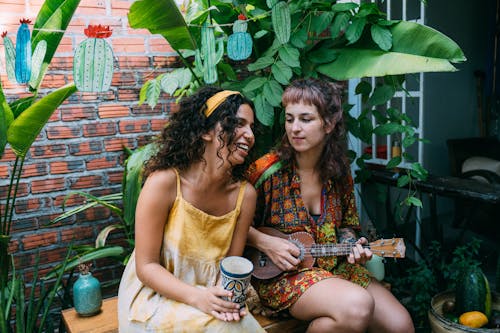 Teenage Girls Having Fun and Sitting on Garden