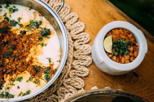 Free Close-up of Mexican bean dishes cooked with lime and herbs, perfect for food photography. Stock Photo