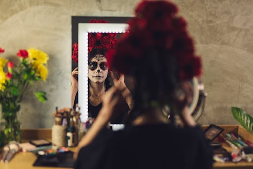 Free  Reflection of a Lady with Face Paint Stock Photo