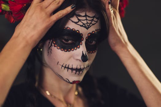 Close-up of a woman with intricate Dia de los Muertos makeup, embodying Mexican cultural traditions.