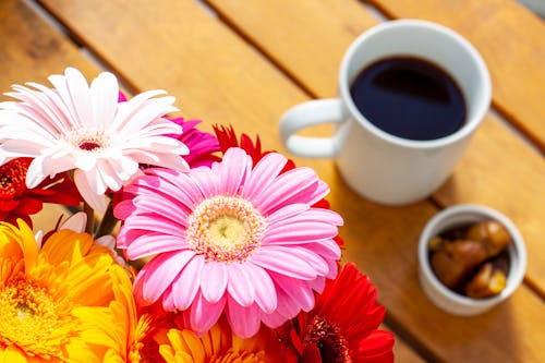 Free Cup of Coffee With Colorful Flowers Stock Photo