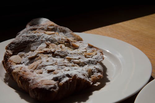 Close-Up Shot of a Pastry With Powdered Sugar on Top