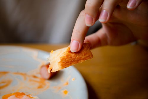 Close Up Shot of Hands Holding Bread