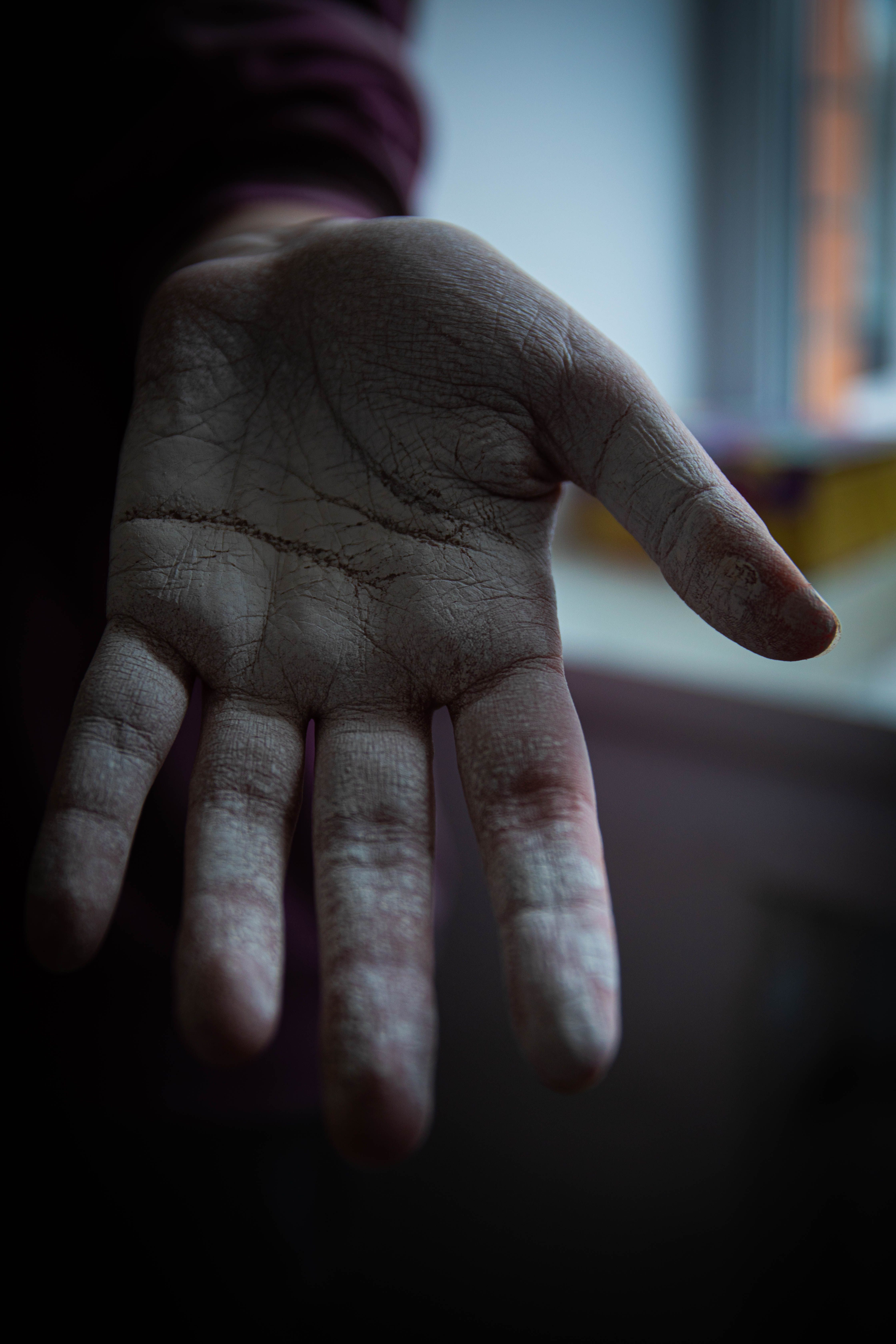Detailed close-up of a human hand in an open position with selective focus and natural lighting.