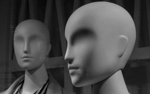 Grayscale Photo of Mannequins Heads