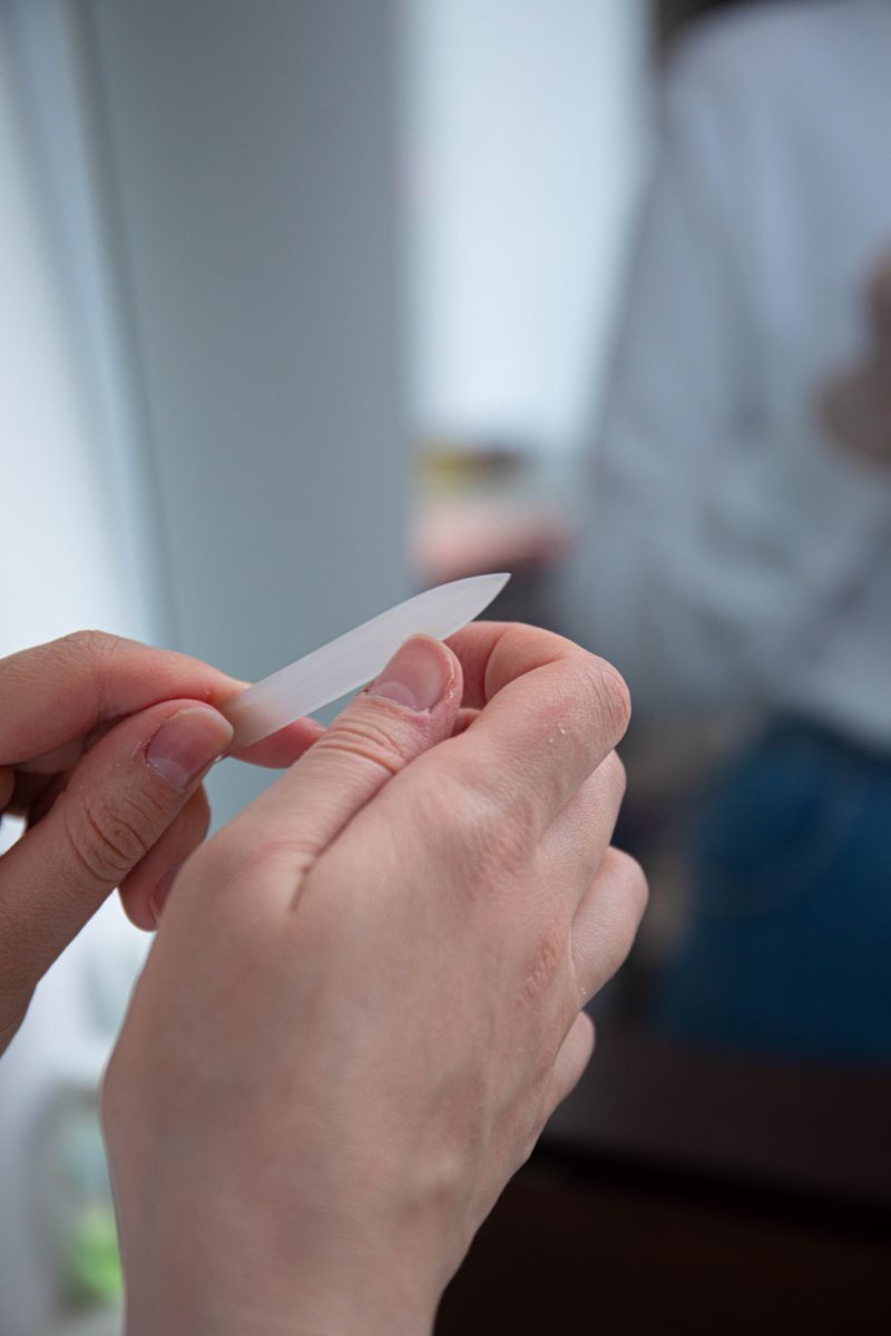Hands using a nail file, a favorite giveaway for podiatry practices