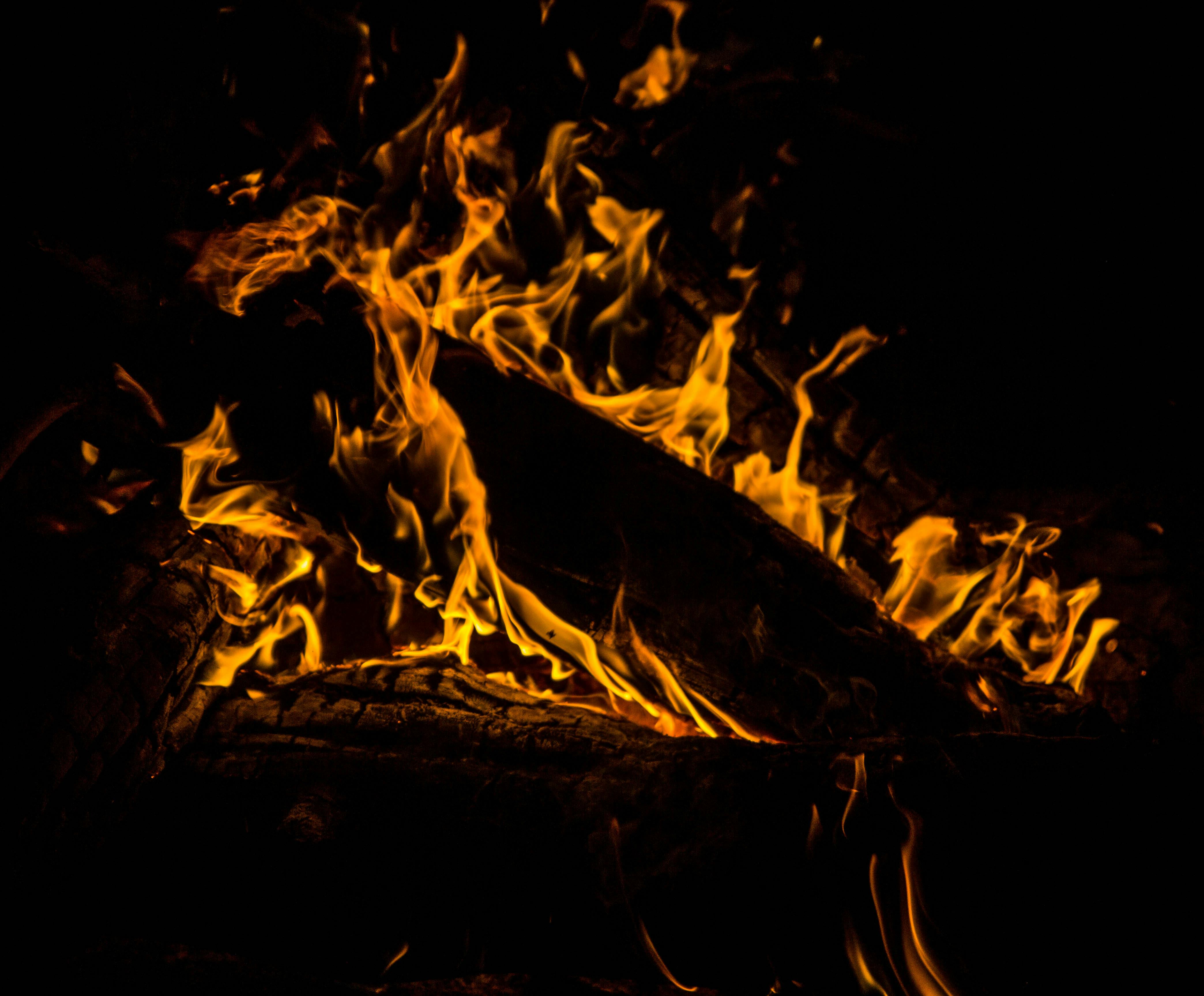 Burning Firelog Surrounded of Pebbles · Free Stock Photo