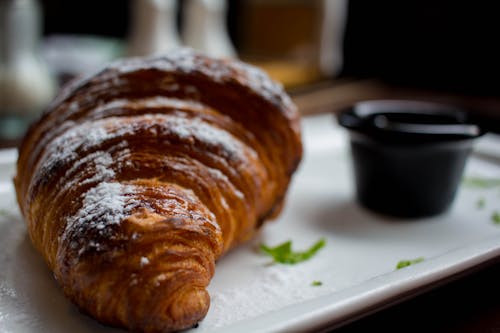 Free A Croissant on a Plate  Stock Photo