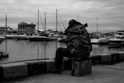 A Person Fishing on Harbor