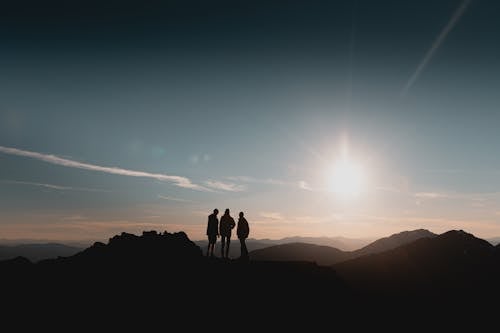 Free Silhouette of People in Mountains Stock Photo