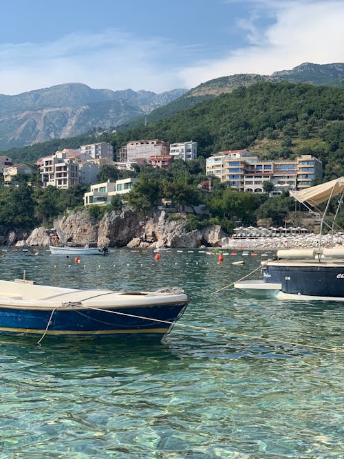 Marina with Boats, and a Town on a Green Hill