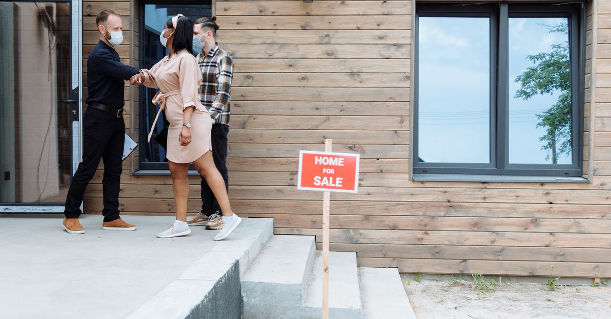 Canadian homeowner family in front of their house, the type the secondary suite loan program aims to help