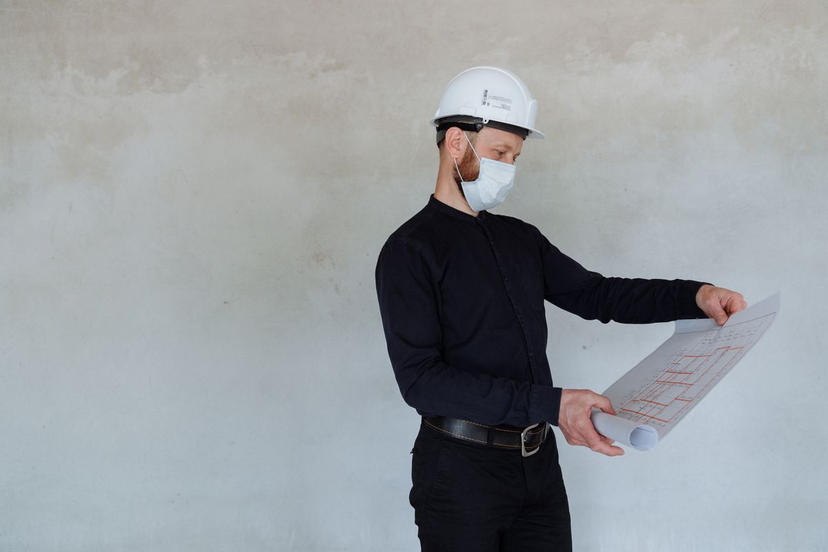 Solar surveyor reviewing installation plans for a Kilmarnock property