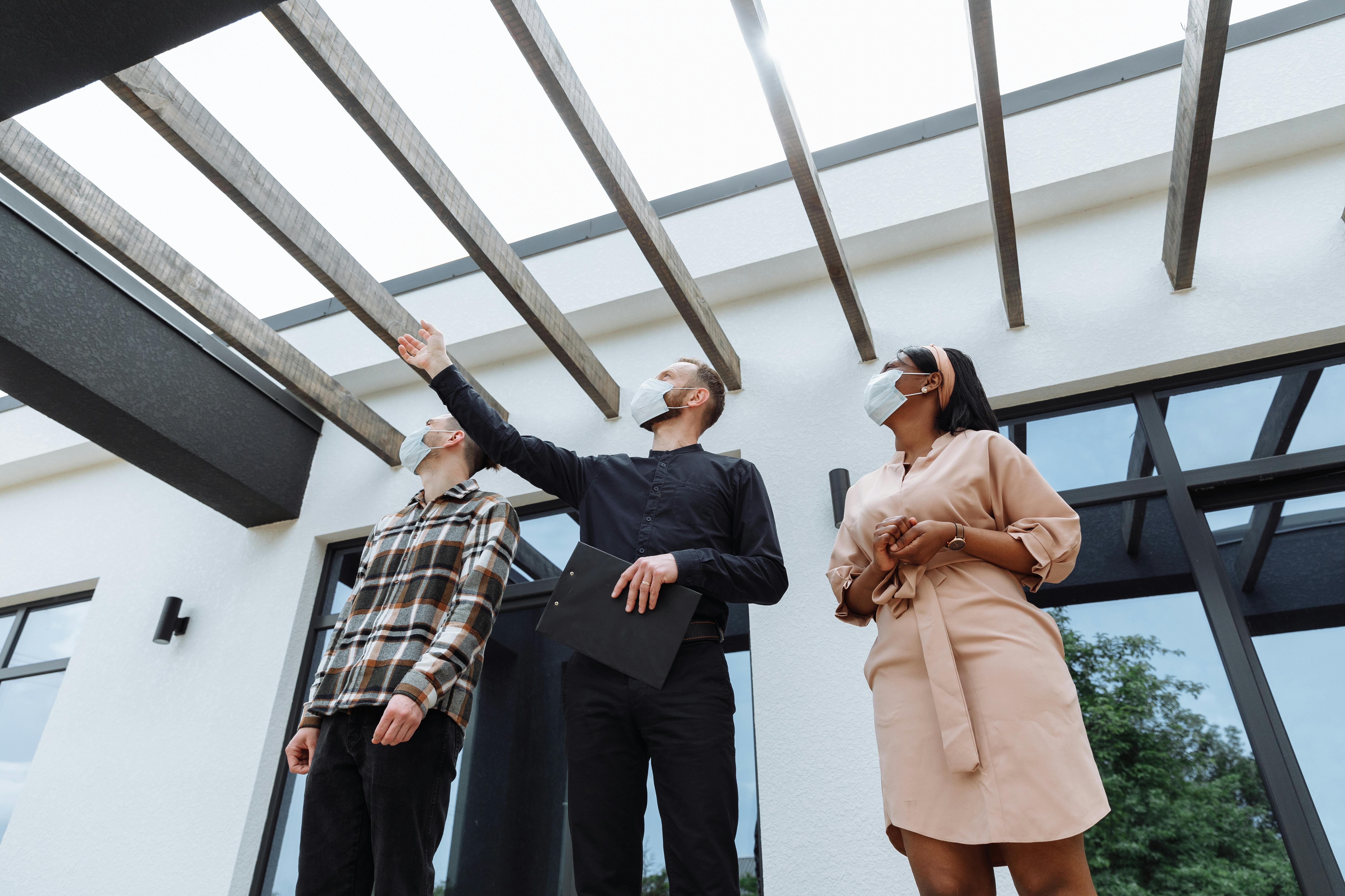 real estate agent showing the house to clients